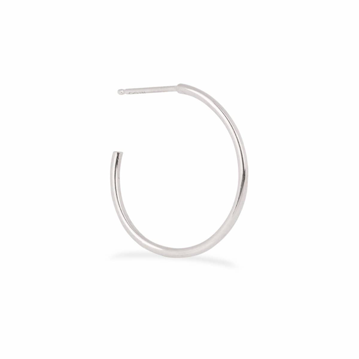 A Crescent Hoop / Medium in white gold on a white background.