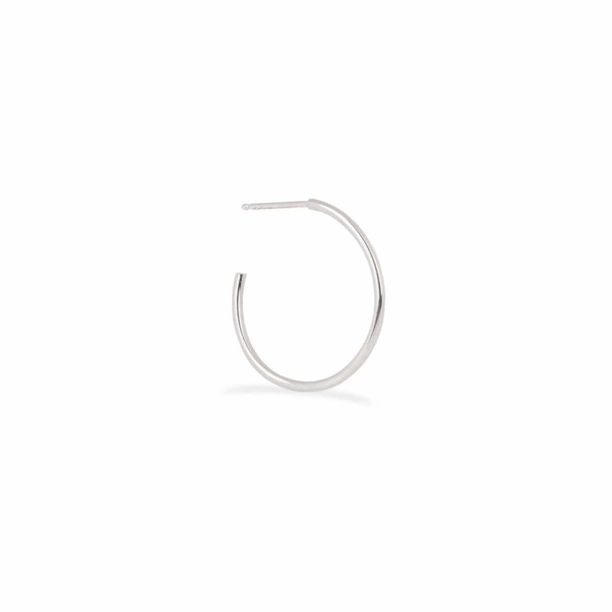 A Crescent Hoop / Small in white gold on a white background.