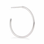 A Crescent Hoop / Large in white gold on a white background.