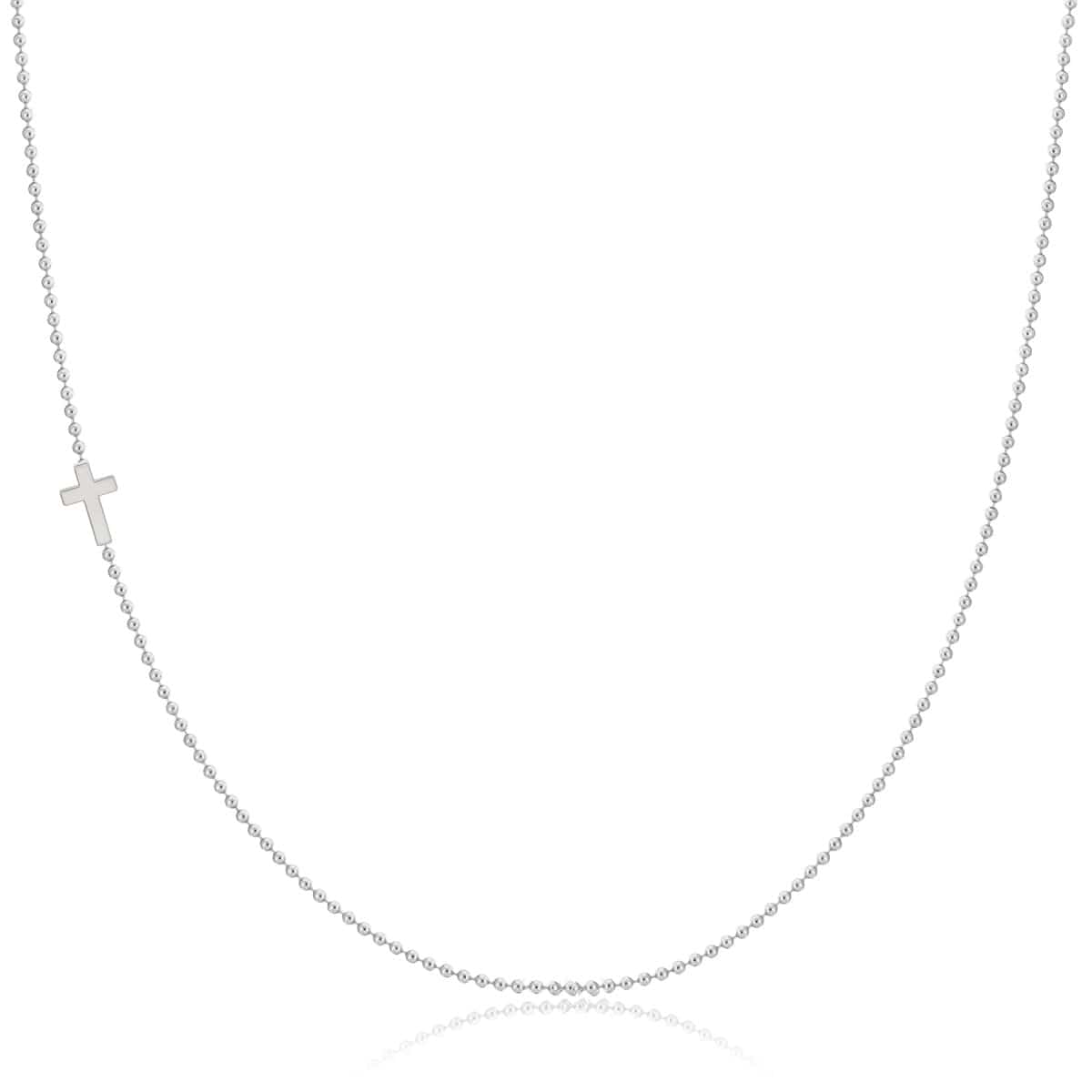 A white gold 14k Gold Asymmetrical Charm Necklace - Cross with a bead chain on a white background. 