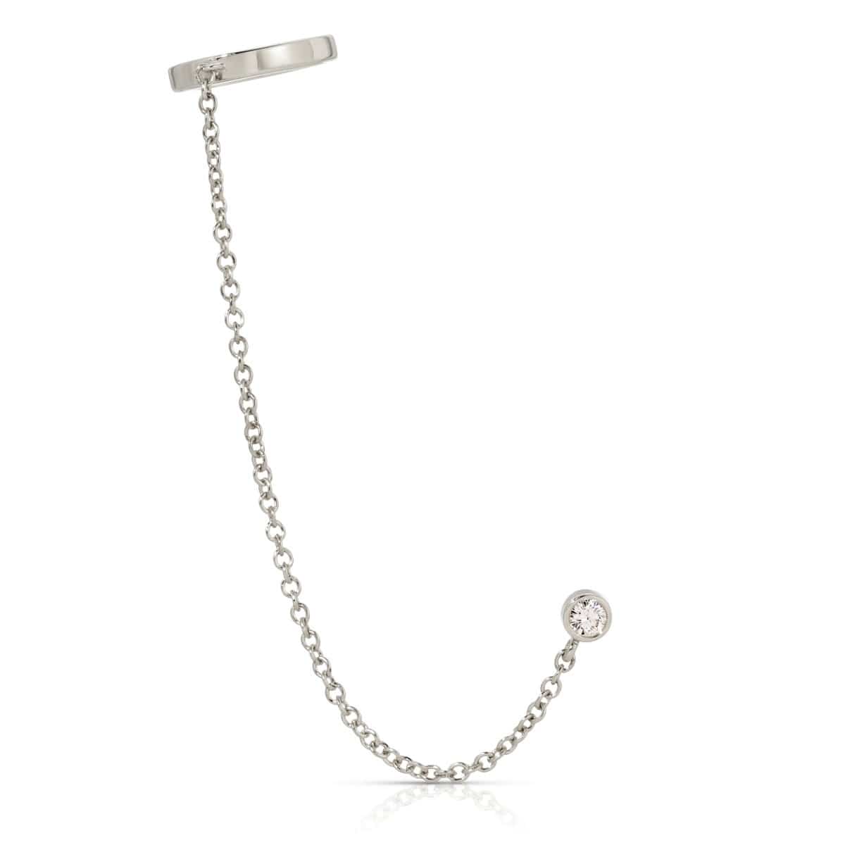 A Coupling Ear Cuff + Stud in white gold on a white background. 