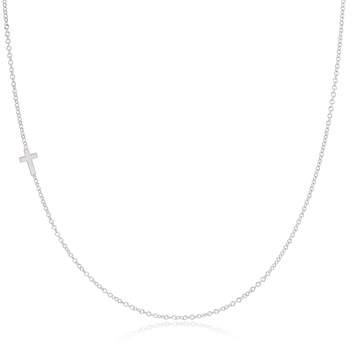 A white gold 14k Gold Asymmetrical Charm Necklace - Cross with a cable chain on a white background. 