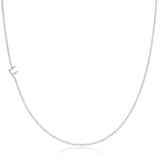 A white gold necklace with a F letter charm on a white background. 