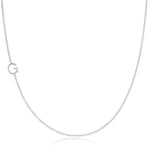 A white gold necklace with a G letter charm on a white background. 