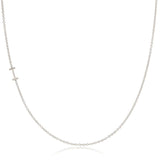 A white gold necklace with an I letter charm on a white background. 