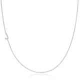 A white gold necklace with a letter J pave charm on a white background.