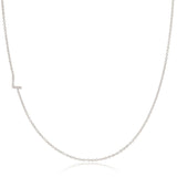 A white gold necklace with a letter L pave charm on a white background.