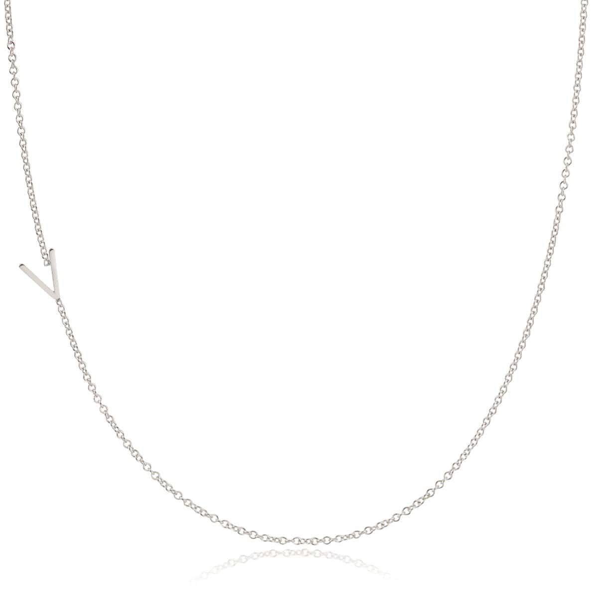 A white gold necklace with a V letter charm on a white background. 