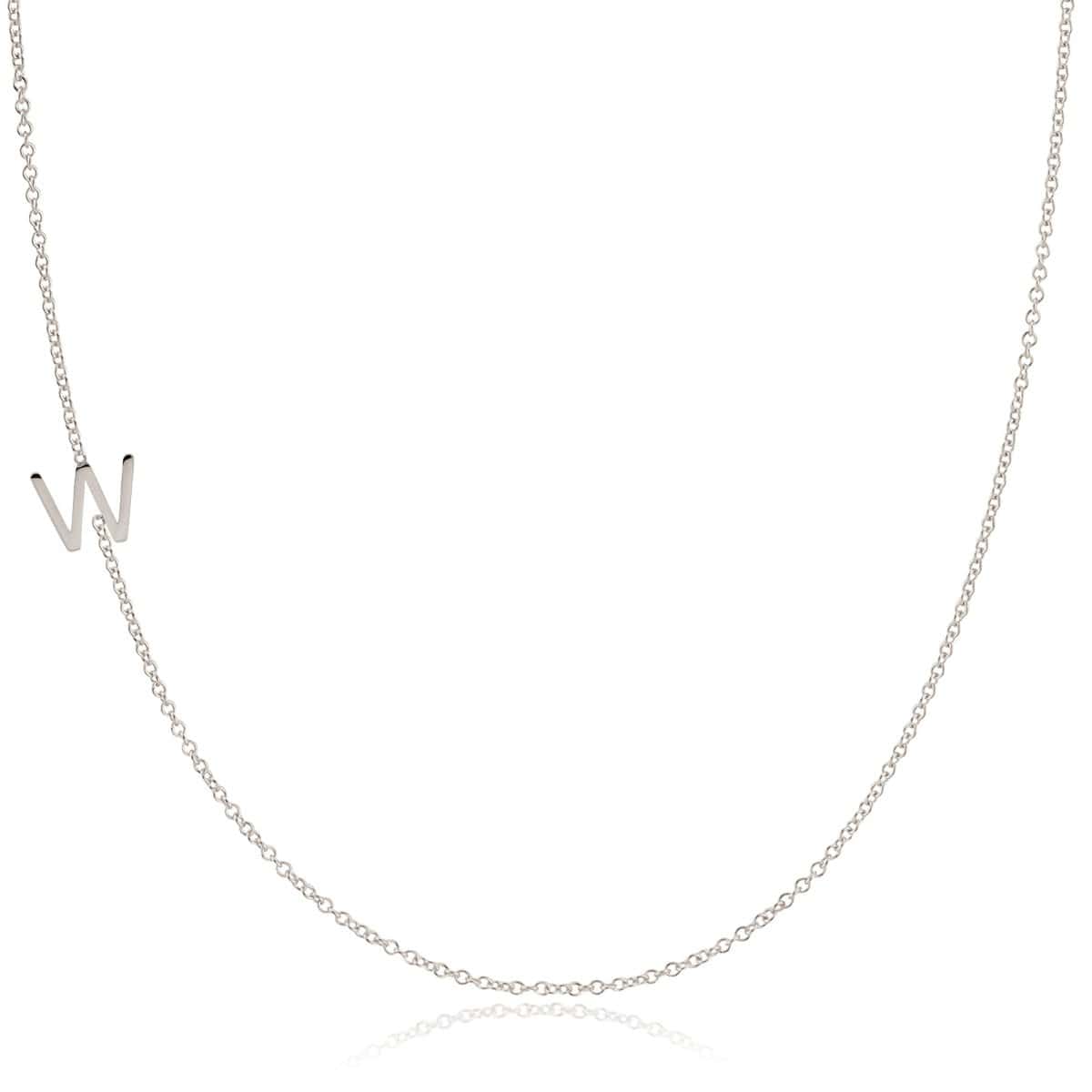 A white gold necklace with a W letter charm on a white background. 
