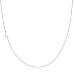 A white gold necklace with an L letter charm on a white background. 