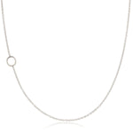 A white gold necklace with an O letter charm on a white background. 