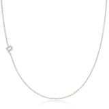 A white gold necklace with a letter P pave charm on a white background.
