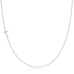 A white gold necklace with a letter T pave charm on a white background.