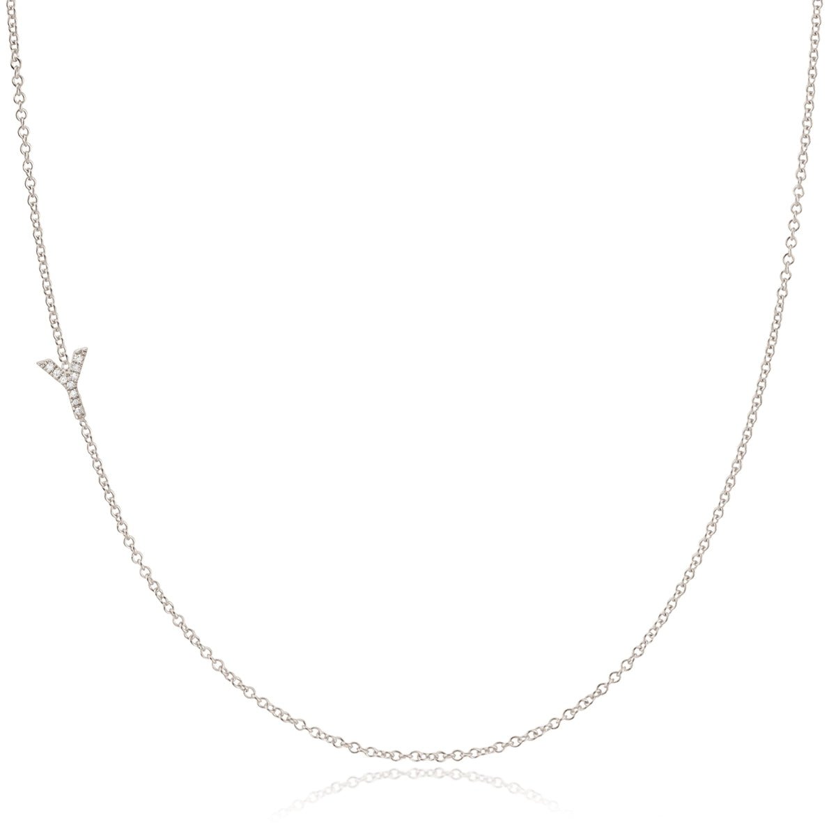 A white gold necklace with a letter Y pave charm on a white background.