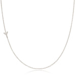 A white gold necklace with a letter Y pave charm on a white background.