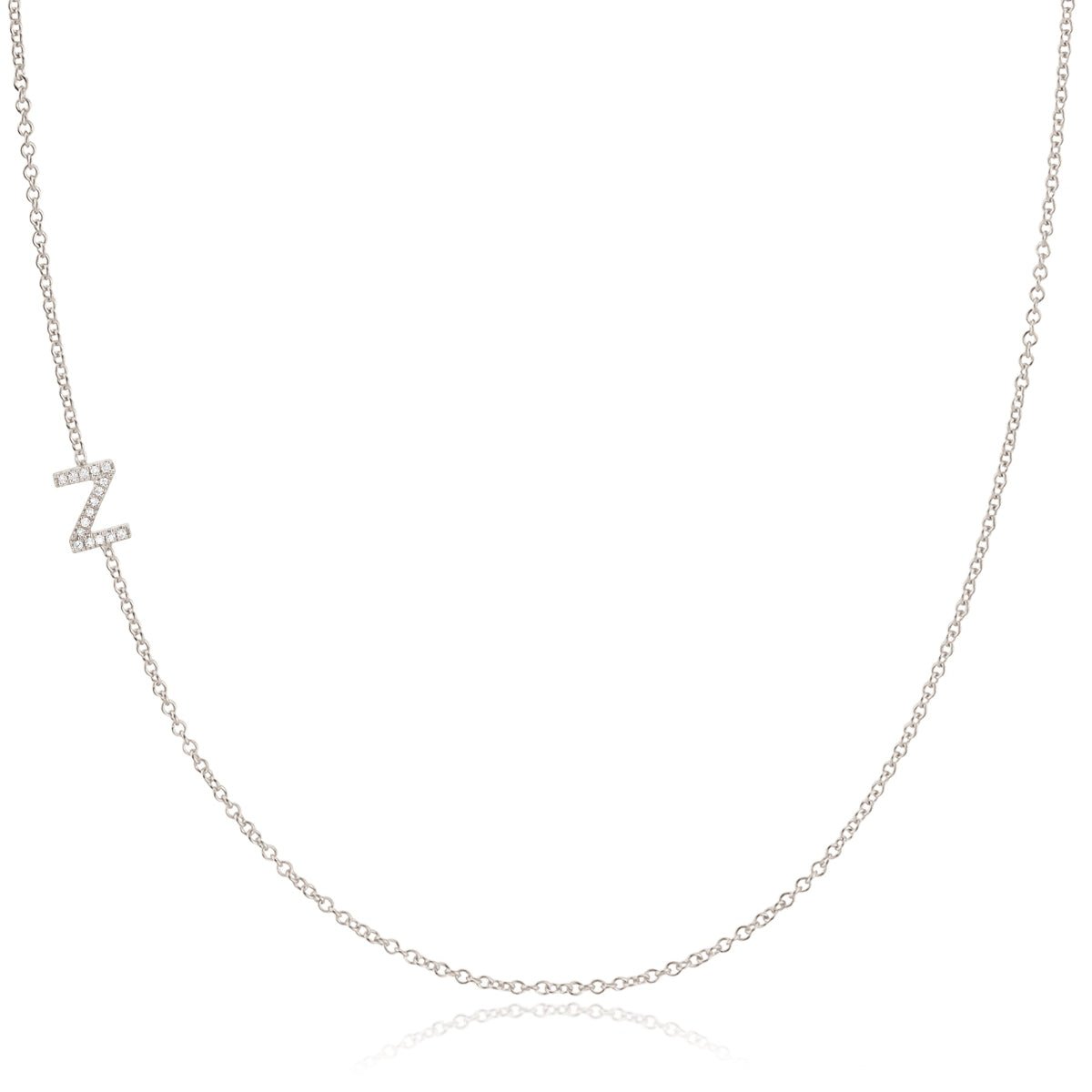 A white gold necklace with a letter Z pave charm on a white background.