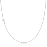 A white gold necklace with a letter T pave charm on a white background.