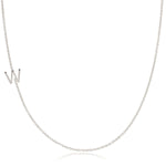 A white gold necklace with a W letter charm on a white background. 