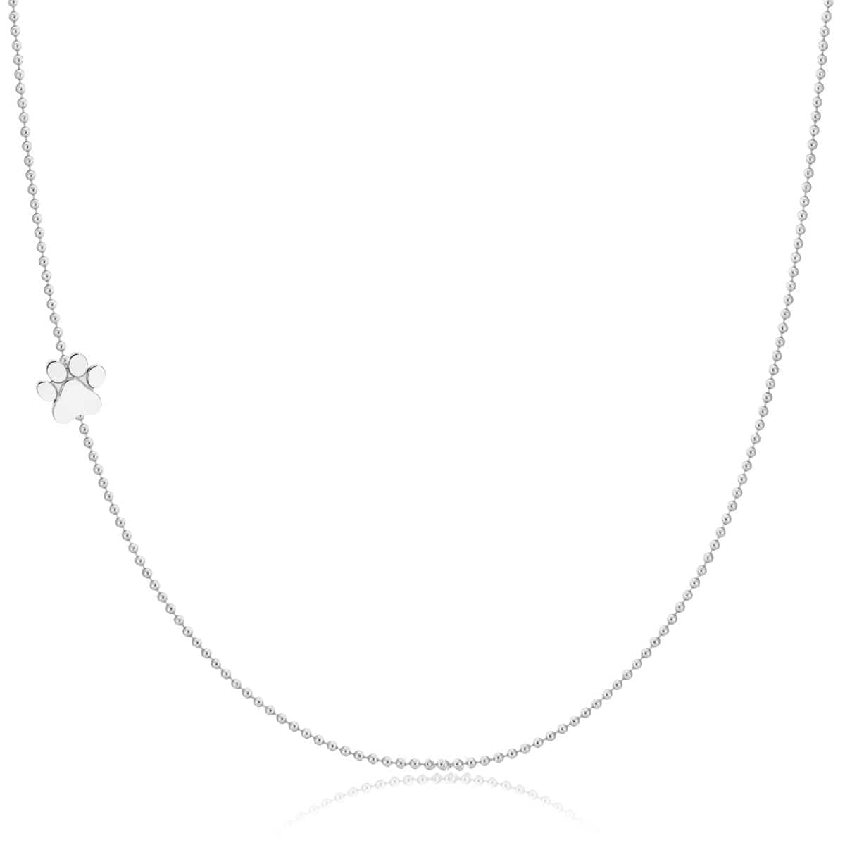 A white gold 14k Gold Asymmetrical Charm Necklace - Paw with a bead chain on a white background. 