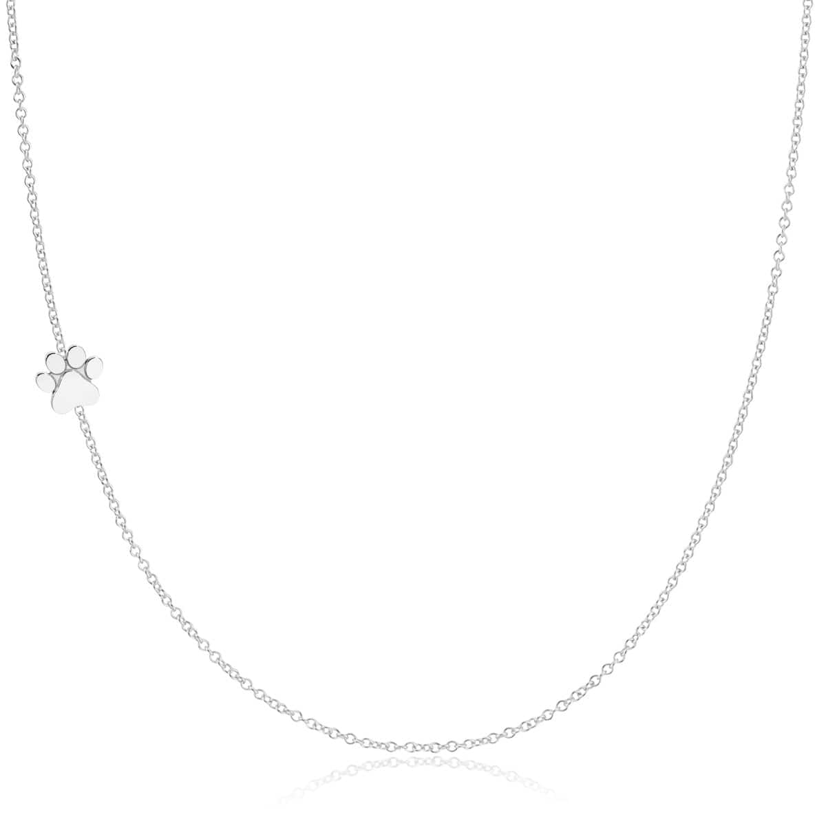 A white gold 14k Gold Asymmetrical Charm Necklace - Paw with a cable chain on a white background. 
