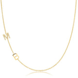 A Custom Gold Necklace in yellow gold with two letter charms, a pavé M and a B positioned on the left side of the necklace, on a white background.