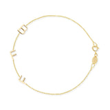 A yellow gold Custom Gold Bracelet - 3 Letters (B, F and F) on a white background. 