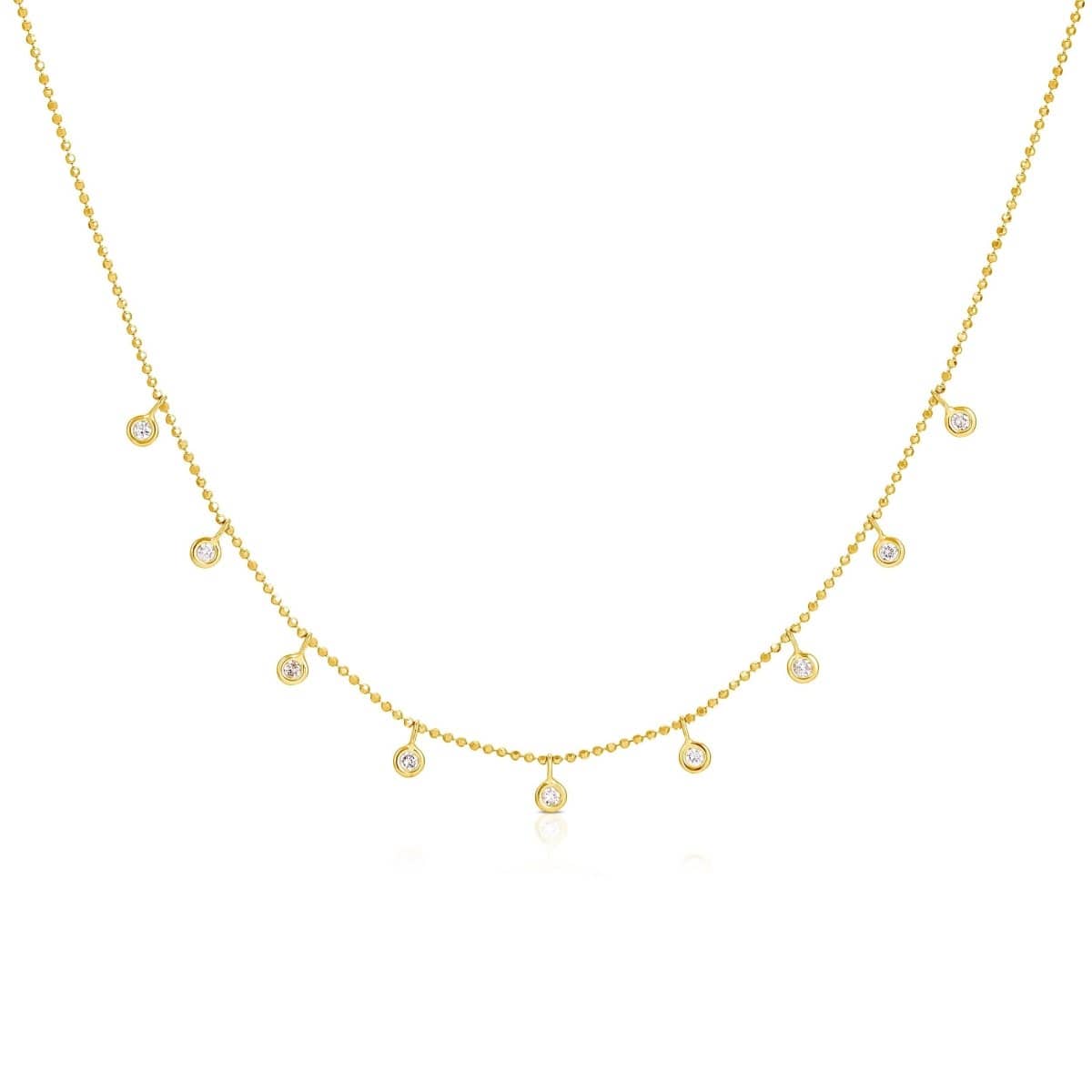A yellow gold Stardust Diamond Necklace on a white background. 