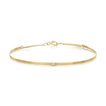 An Off the Cuff Bracelet in yellow gold on a white background.