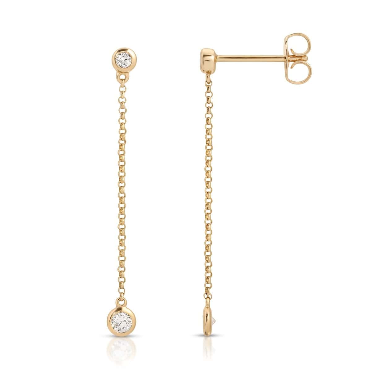 Droplet Diamond Earrings in yellow gold on a white background. 