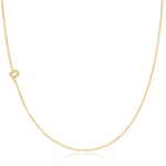 A yellow gold necklace with a pave letter P charm on a white background. 