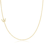 A yellow gold necklace with a pave letter W charm on a white background. 