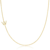A yellow gold necklace with a pave letter W charm on a white background. 