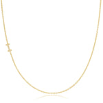 A yellow gold necklace with a pave letter I charm on a white background. 