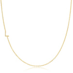 A yellow gold necklace with a pave letter L charm on a white background. 