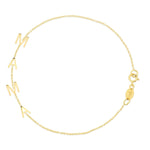 A Mama Bracelet in yellow gold with a cable chain on a white background. 