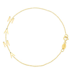 A Mama Bracelet in yellow gold with a cable chain on a white background. 