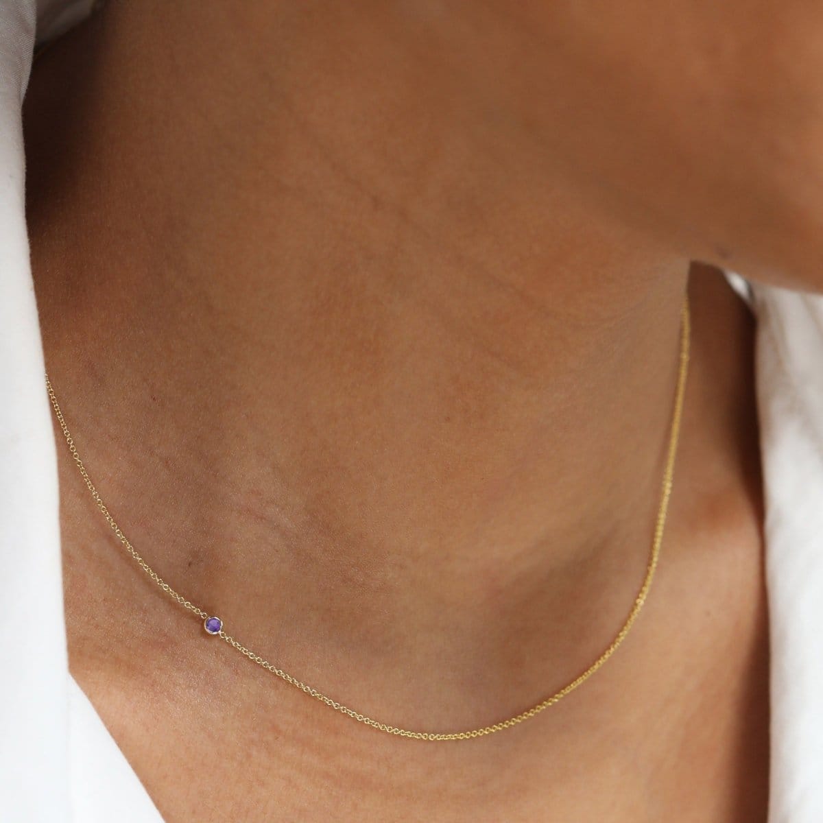 A white gold 14K Gold Asymmetrical Birthstone Necklace - Amethyst (February) on a white background. 
