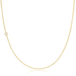 A yellow gold 14K Gold Asymmetrical Birthstone Necklace - Pearl (June) on a white background. 