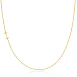 A yellow gold necklace with an I letter charm on a white background. 