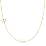 A yellow gold necklace with a W letter charm on a white background. 
