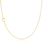A yellow gold necklace with an O letter charm on a white background. 