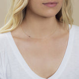 A yellow gold 14k Gold Asymmetrical Number Necklace - 5 on a white background. 