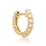 An Alli Webb Opal Huggie on a white background. 