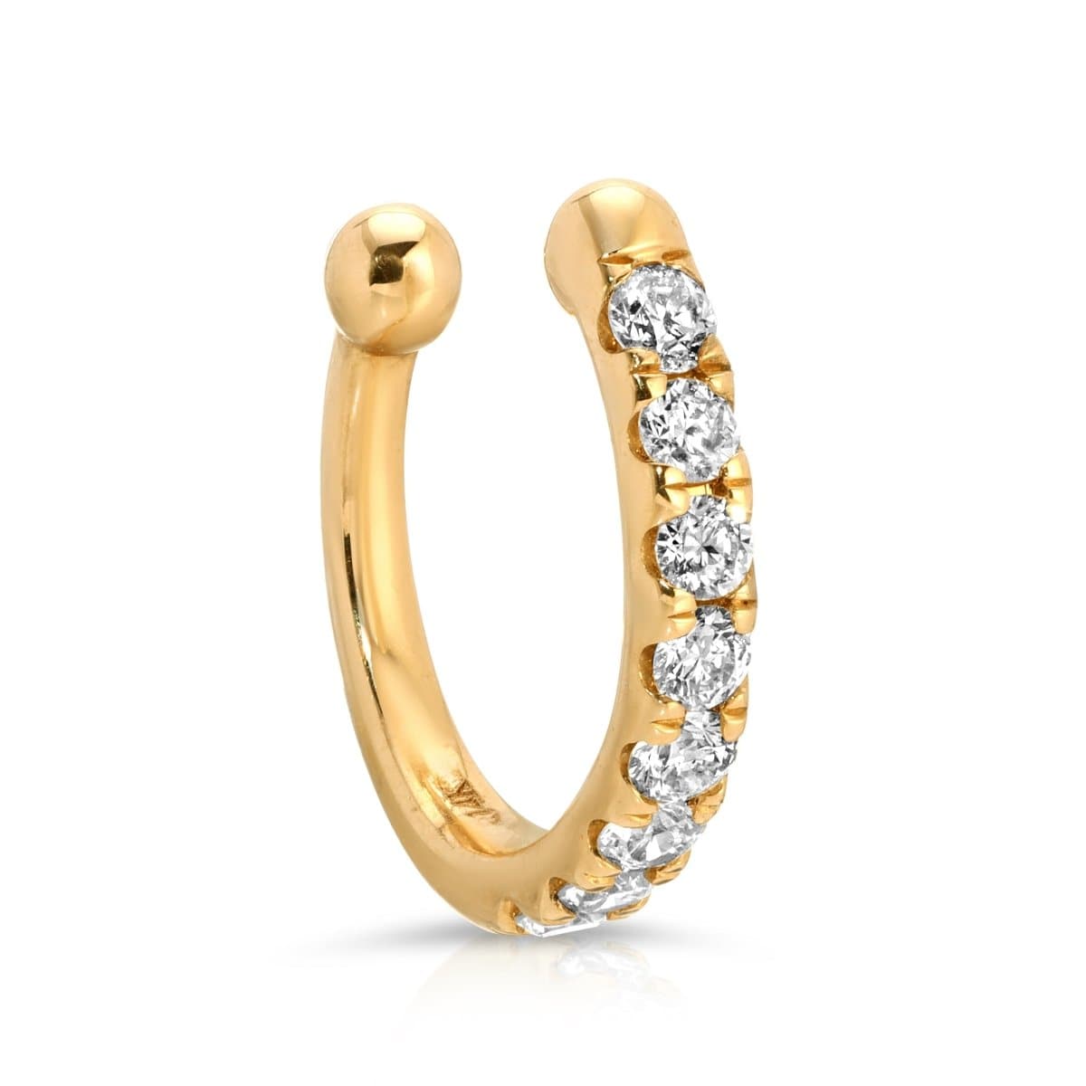 A Pavé Ear Cuff in yellow gold on a white background. 