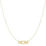 A Pavé MOM Necklace in yellow gold on a  cable chain on a white background. 