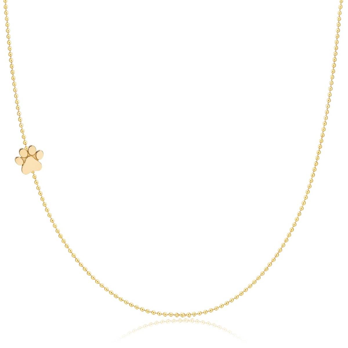 A yellow gold 14k Gold Asymmetrical Charm Necklace - Paw with a bead chain on a white background.