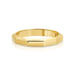 A Tenfold Ring in yellow gold on a white background. 