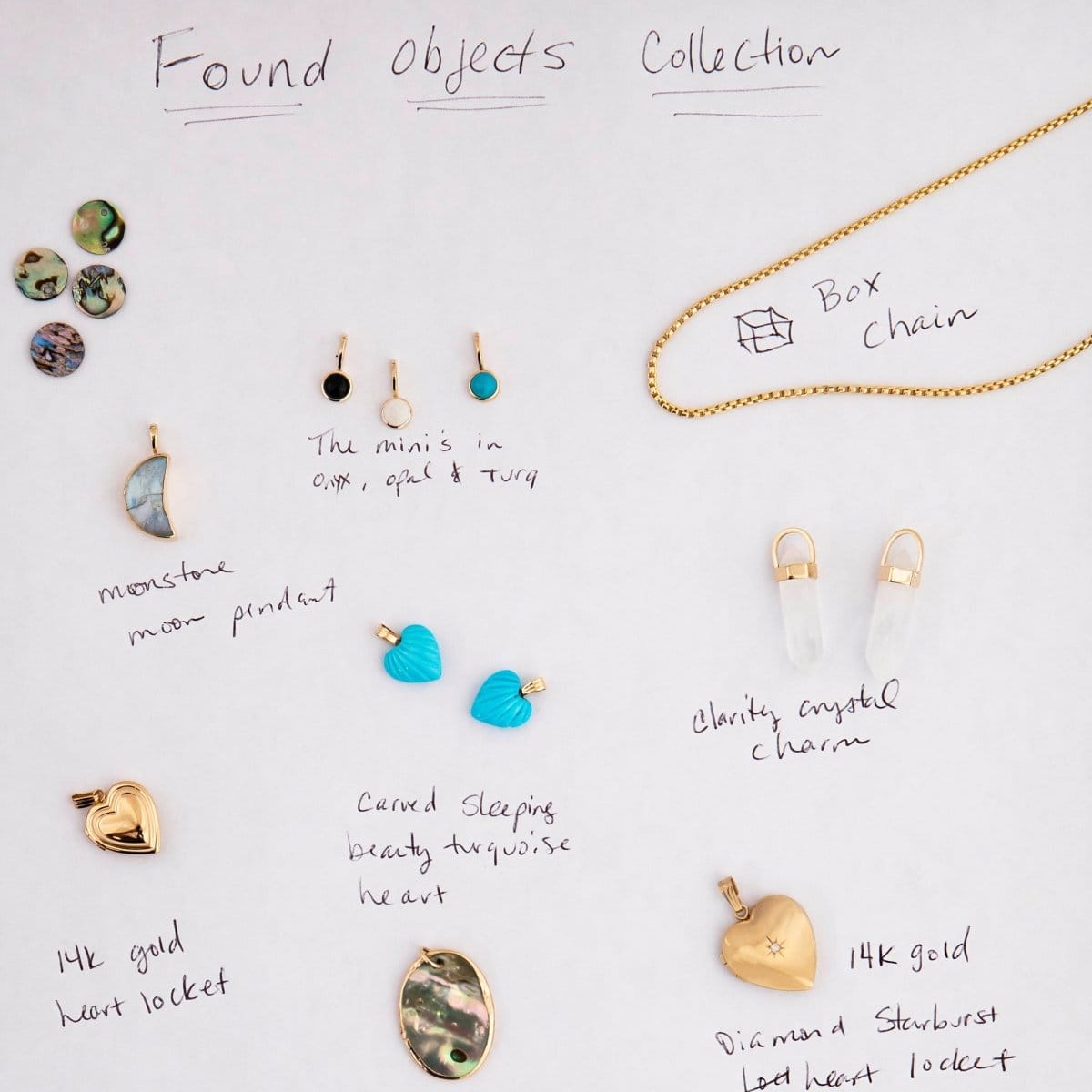 Collection of various jewelry items on a white surface with labels.