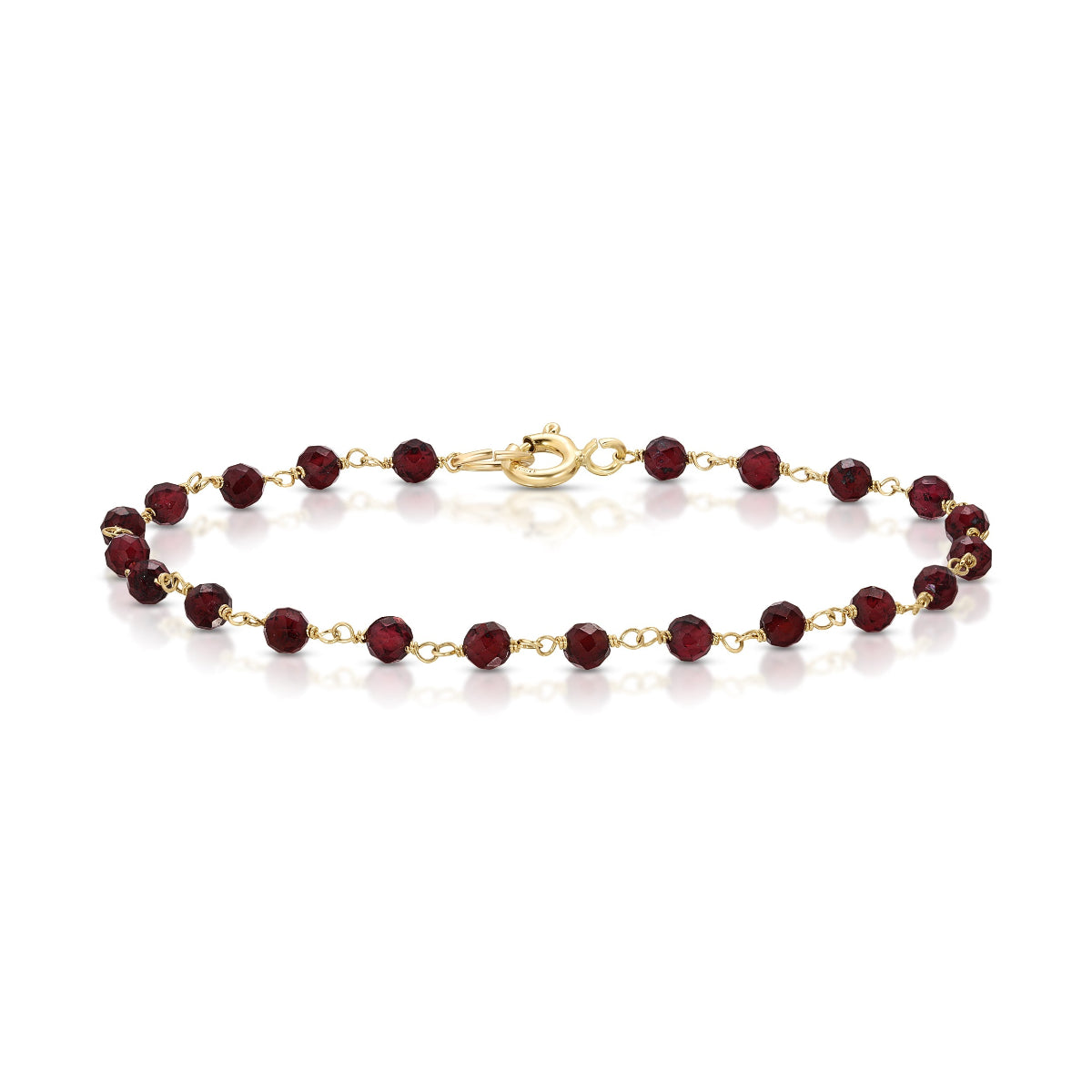 A bracelet featuring 3mm faceted garnet beads with 10k yellow gold wire and a large spring clasp closure.