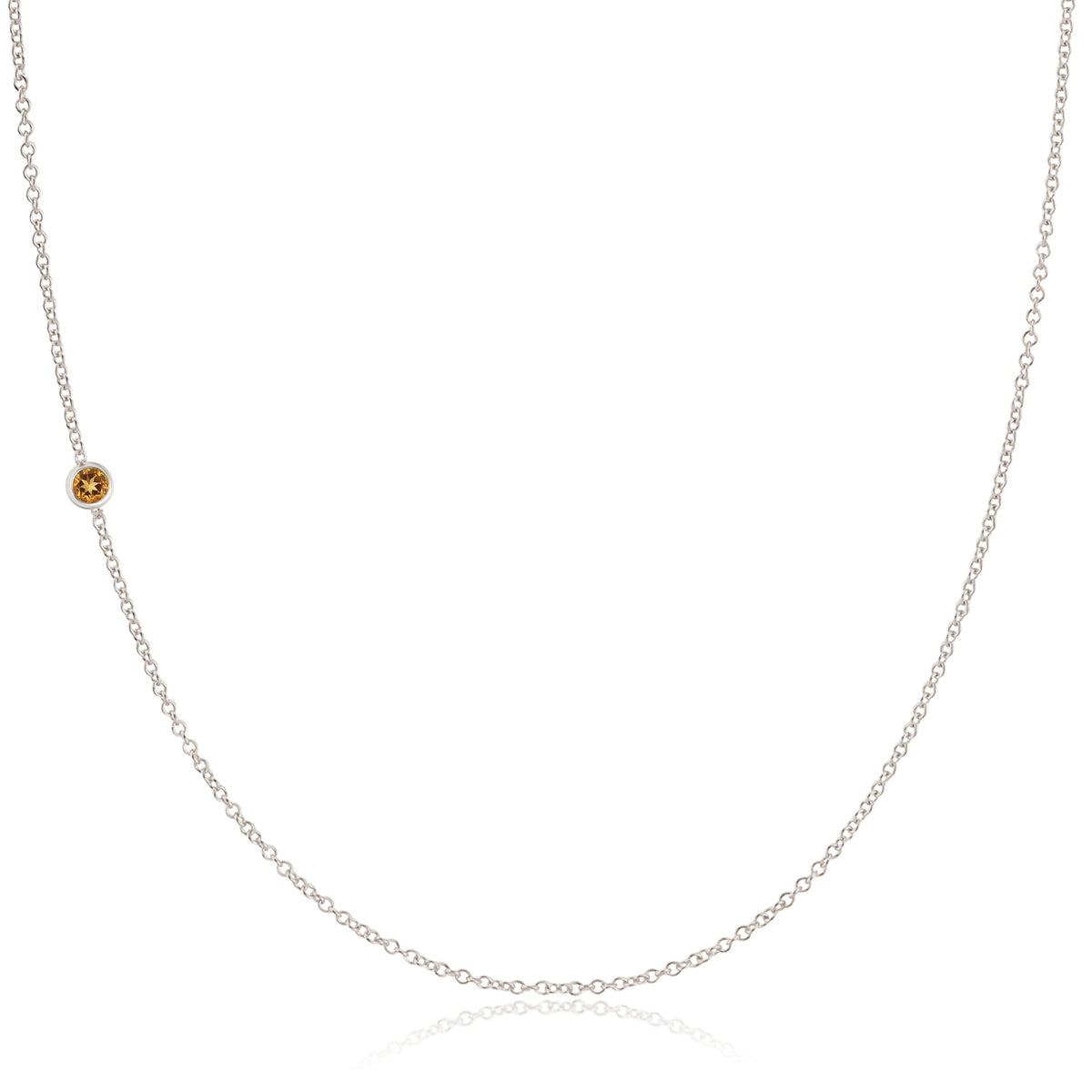 A single citrine birthstone necklace on a chain, indicating it is the November birthstone.